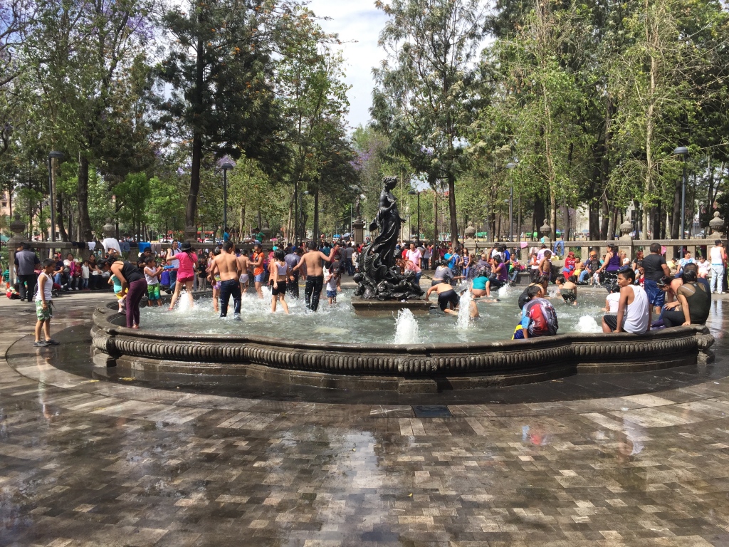 Children play in a fountain in Mexico City.