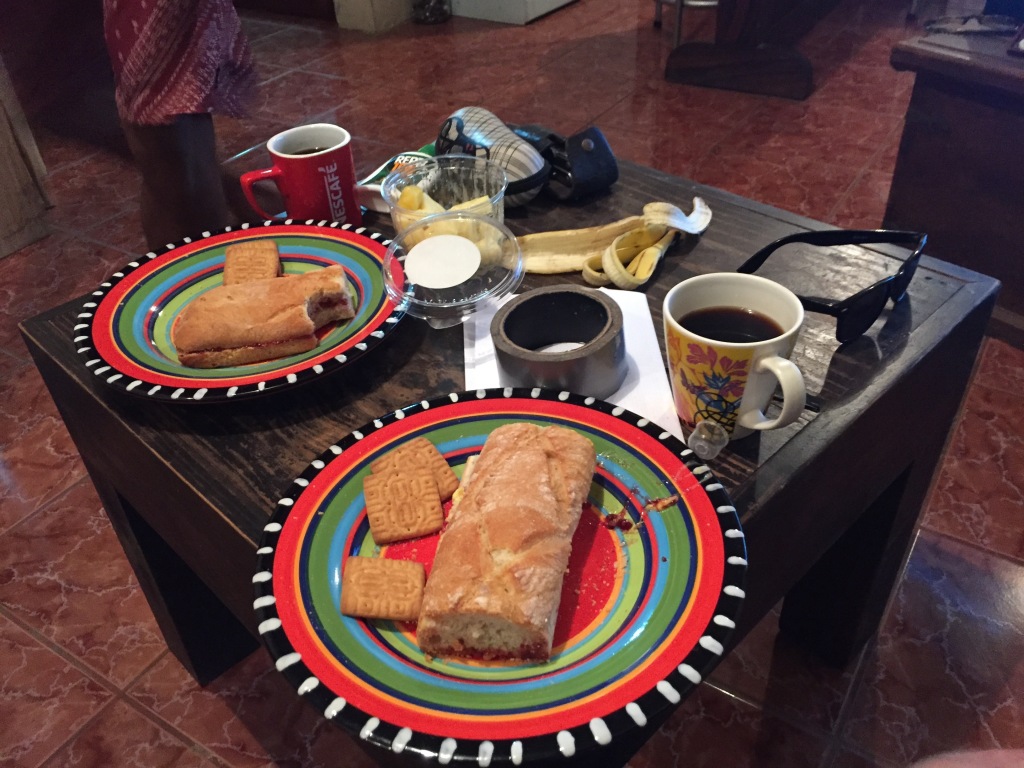 Bread, coffee, and bananas on a table in a living room in Costa Rica.