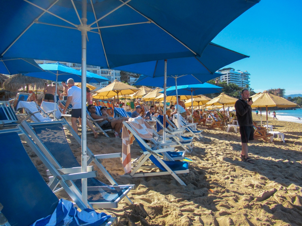 Many beach chairs line Los Muertos Beach in Puerto Vallarta.