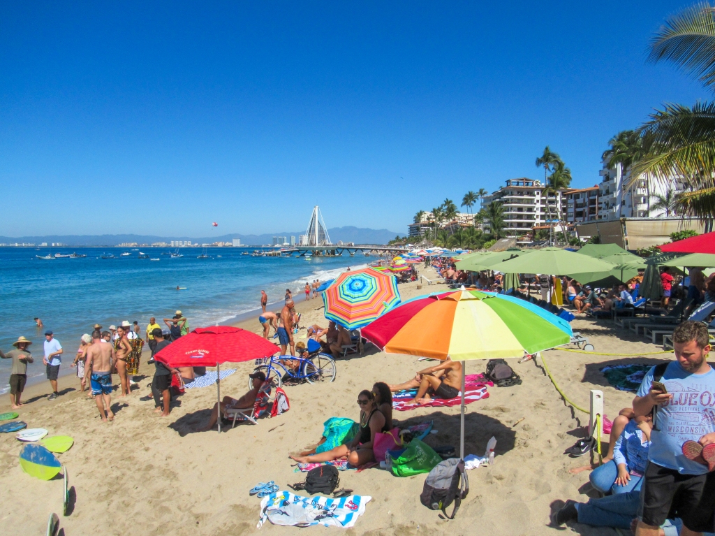 Tourists enjoy the sun at Los Muertos Beach in Puerto Vallarta.