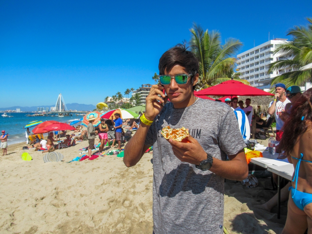 Gerardo Valencia eats pizza in Puerto Vallarta.