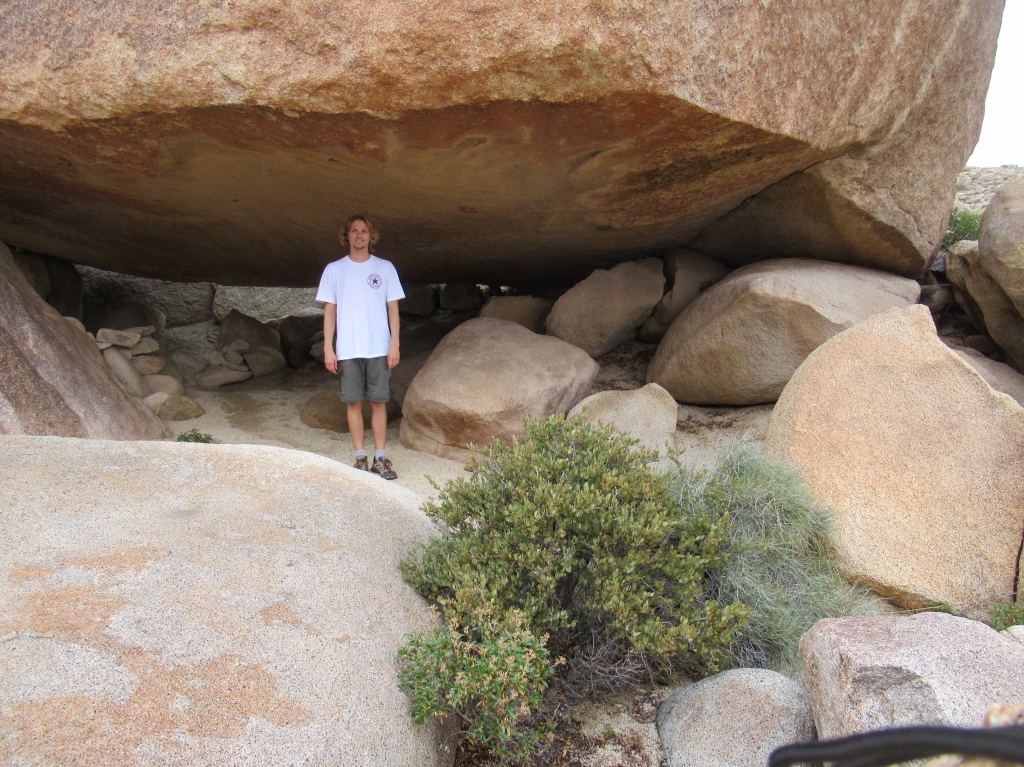Evan Quarnstrom standing in the solstice cave of Anza Borrego.